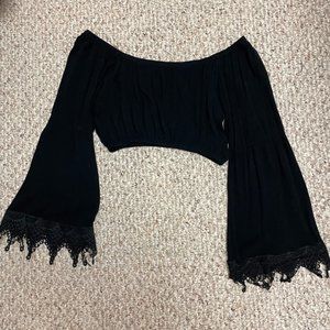 Small black off-the-shoulder long-sleeve crop top with lace trim on sleeves